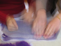 2 pairs of hands making felt